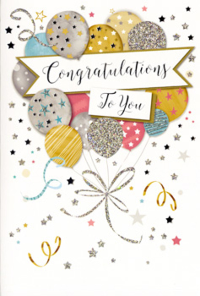 The photograph captures a refined congratulations card propped open slightly, as though waiting to be signed before being tucked alongside a hand-tied bouquet. The artwork on the front is built around a cluster of balloons, each one rendered with care in muted yet luminous tones of gold, silver, champagne, soft sky blue, blush pink, and quiet grey. Every balloon has its own personality: some are speckled with tiny metallic stars, others are dusted with fine glitter or traced with slender, shimmering stripes. Subtle highlights give them a rounded, three-dimensional feel, as if they're gently lit from an unseen window, much like the soft afternoon light that falls across homes in Lewisham or down quiet streets near Ladywell Fields. Threading through the centre of this balloon bouquet is a graceful banner, unfurled like a satin ribbon, bearing the words Congratulations To You in flowing, calligraphic lettering. Around the main motif, delicate stars, twirling ribbons, and confetti-like dots scatter across a pale backdrop, hinting at the joyful chaos of a surprise celebration. The palette remains calm and sophisticated, more champagne toast than loud party, making it perfect for moments of real achievement-a degree earned, a promotion in the City, or a new chapter beginning. Seen through the eyes of a local florist, this card pairs beautifully with elegant blooms, offering a polished, heartfelt way to share pride and encouragement anywhere across Lewisham and the surrounding neighbourhoods.